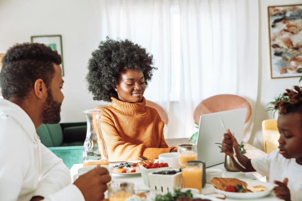 Family sharing breakfast together at home